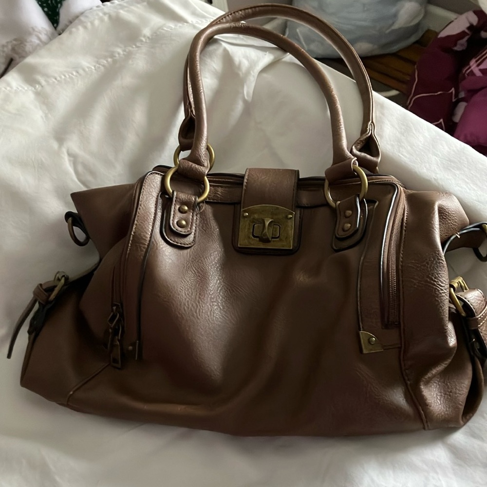 Purse - medium brown. Not real leather. 15” x 11”. Roughly 10” purse handle.